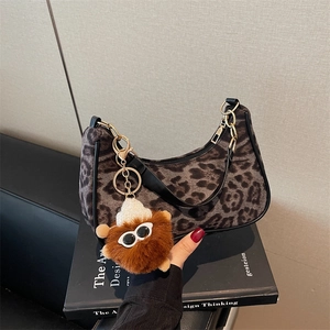 Vintage faux suede leopard print hobo bag with cute monster charm and black leather handle