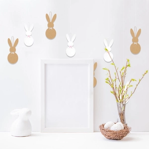 Easter bunny paper hangers in white and kraft colors with pink bows for party decor