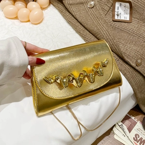 Chic gold chain shoulder bag with unique wavy metal buckle and textured leather