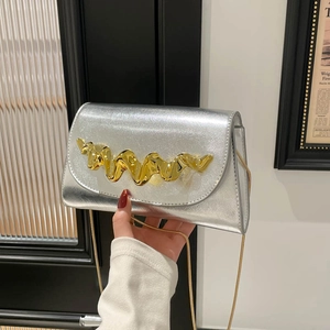 Silver metallic rectangular flap bag with golden wave decor and thin snake chain strap