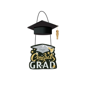 Close-up of Congrats GRAD paper hanging decoration with mortarboard and gold tassel