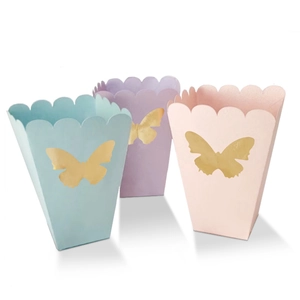Pastel popcorn snack boxes with gold butterfly designs in pink, blue, and purple hues