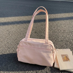 Pink minimalist canvas tote bag with front zipper pocket and long shoulder straps