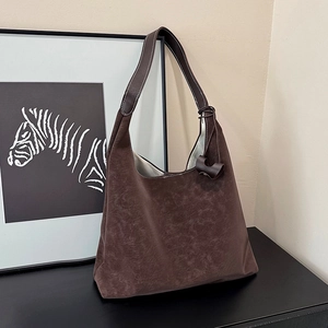 Vintage dark brown large tote bag with a soft hobo silhouette and wide shoulder straps