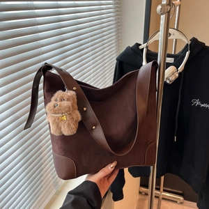 Large dark brown suede Hobo shoulder bag with golden rivets and a teddy bear charm