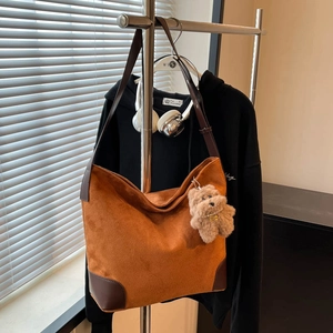 Minimalist camel suede tote bag with brown leather trim and cute bear charm