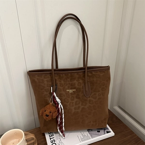 Large leopard print tote bag with brown suede texture and cute plush teddy charm