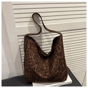 Detailed view of the brown leopard print pattern and soft texture on the oversized tote bag