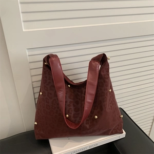 Retro burgundy leopard print tote bag with gold studs and wide shoulder strap