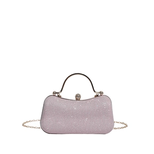 Pink rhinestone evening bag with golden metal handle and crossbody chain strap
