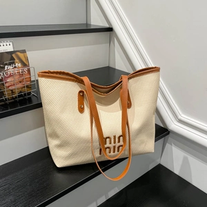 Minimalist beige woven tote bag with large capacity and brown leather trim for women