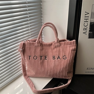 Pink corduroy tote bag with TOTE BAG embroidery and adjustable shoulder strap
