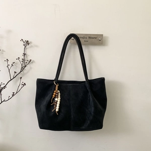 Minimalist black suede leopard tote bag with retro wooden bead charm accessory