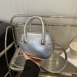 Silver metallic crossbody handbag with mirror finish and adjustable strap for women