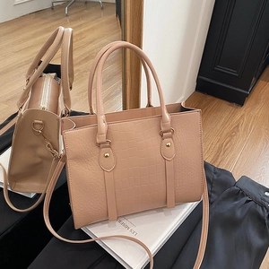 Nude pink crocodile embossed tote bag with gold hardware and shoulder strap for women