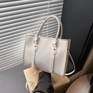 White faux crocodile embossed tote bag with gold hardware and dual handles