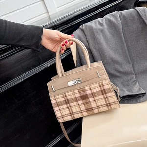 Elegant khaki leather and pink plaid handbag featuring a classic gold-tone turn-lock