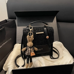 Elegant leopard print crossbody bag with rabbit pendant in a premium gift box