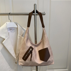 Large capacity canvas tote bag with brown straps and stylish pockets for women