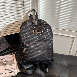 Chic black starry backpack with star patterns and front pocket for daily commute