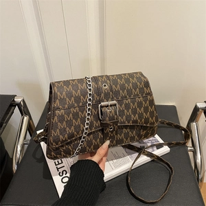 Vintage brown monogram crossbody bag with silver chain strap and stylish M-pattern print