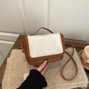French vintage saddle bag with brown leather and white faux shearling patchwork