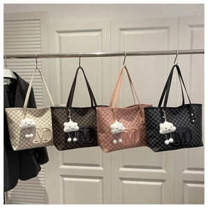 Detailed display of tote bags in four colors with letter prints and cloud charms