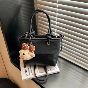 Suede patchwork black tote bag with dual ring handles and cute plush bear charm