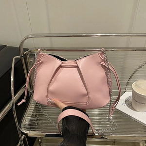 Pink PU leather tote bag with drawstring detail and silver metal chain strap
