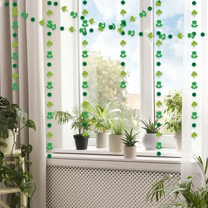 Hanging green St. Patrick's Day shamrock and lucky hat ornaments for party decoration