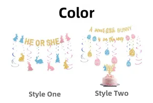 Detail of 'He or She' glitter banner and bunny cake toppers for gender reveal parties