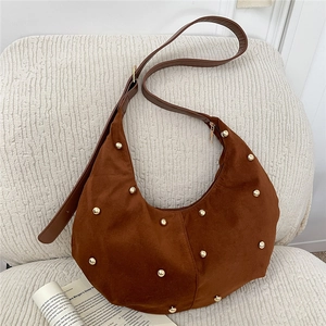 Vintage brown suede crescent tote bag with gold studs and adjustable shoulder strap