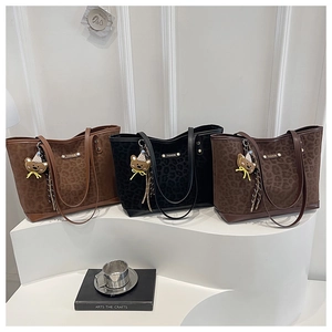 Three leopard print tote bags with bear charms in brown, black and coffee leopard suede