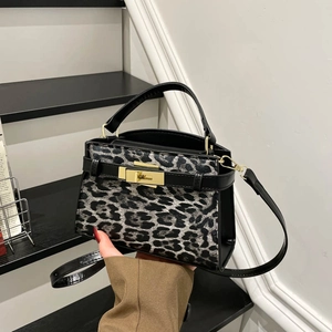 Leopard print crossbody handbag with gold twist lock and black leather trim for women