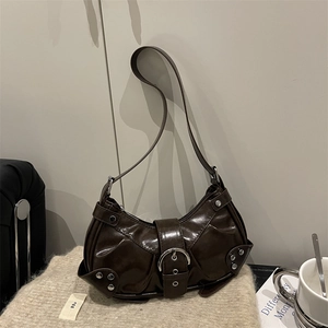 Vintage dark brown crescent shoulder bag with silver studs and polished faux leather