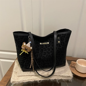 Large leopard print tote bag in frosted finish with a cute bear plush keychain