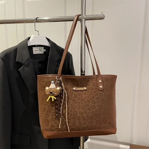 Matte leopard print tote bag with brown leather straps and fashion metal plaque