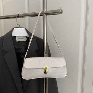 White faux crocodile leather underarm bag with gold lock buckle and slender shoulder strap