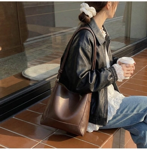 Brown vintage large tote bag shown on model for daily commuting lifestyle style