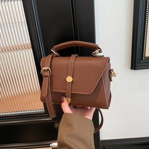Vintage brown lychee texture leather handbag with gold hardware and top handle