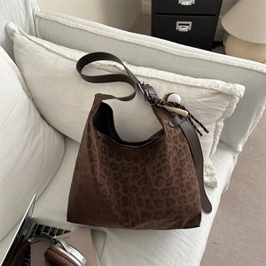 Brown leopard print large hobo shoulder bag styled with everyday work accessories