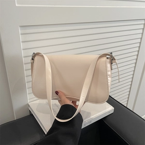 Minimalist cream white underarm bag with matte leather finish and silver hardware buckle
