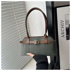 Detail of grey leopard print suede handbag with brown leather belt buckle and long handles