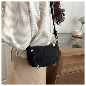 Black matte crescent crossbody bag with stylish knot strap detail and silver hardware