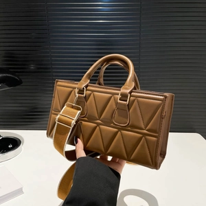 Brown quilted triangle pattern tote bag with adjustable canvas strap for women