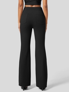 Detail view of high waisted black flare yoga pants with rear pockets on model