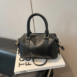 Retro black leather Boston handbag with top handles and adjustable shoulder strap