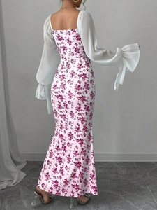 Detail of floral print maxi dress featuring elegant backless design and chiffon puff sleeves