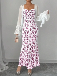 Detail of sweetheart neckline and floral chiffon sleeves on a slim-fit maxi dress
