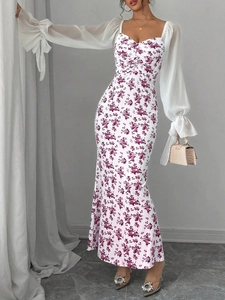 Detailed view of the floral print pattern and sheer chiffon lantern sleeves on the dress